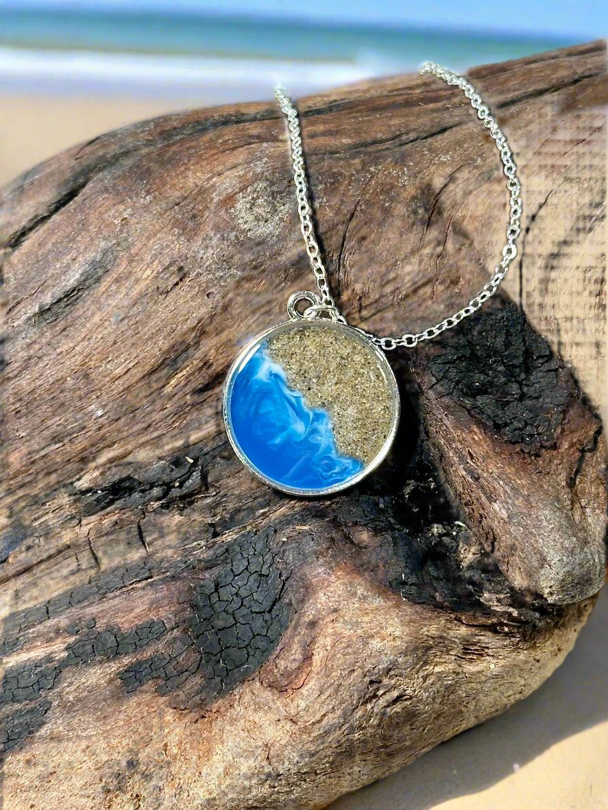 This is a picture of a pendant  necklace representing Pismo beach.